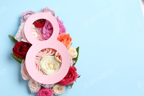 Preview: 8 March greeting card design with beautiful roses on light blue background, top view. Space for text