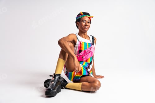 Preview: Fashionable fluid gender man posing in studio