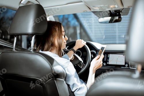 Preview: Woman with phone in the car