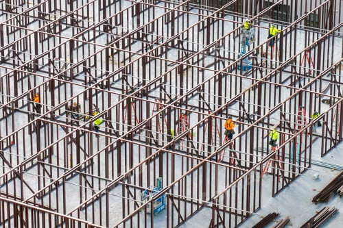 Preview: Construction works on metal walls of commercial building.