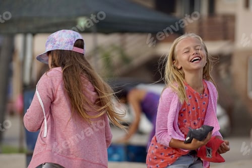 Preview: Happy friends at the beach, playing Cornhole
