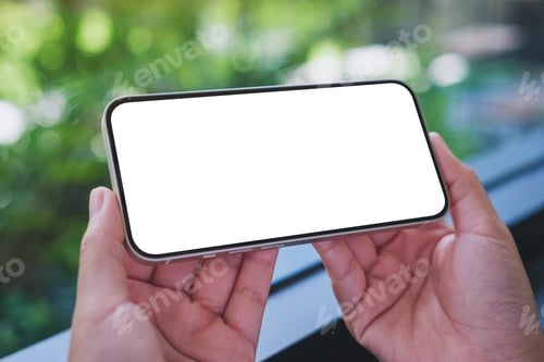 Preview: Mockup image of a woman holding mobile phone with blank desktop screen in cafe