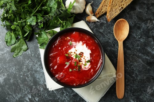 Preview: Concept of tasty eating with borscht on black smokey background