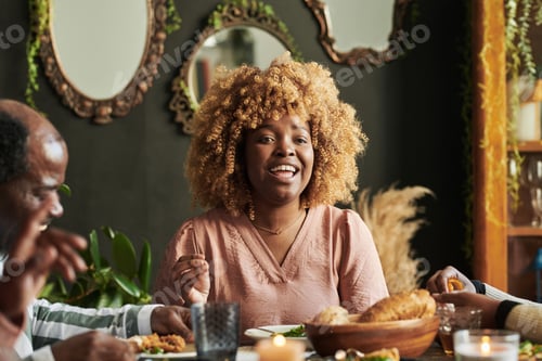 Preview: Happy woman having dinner with family