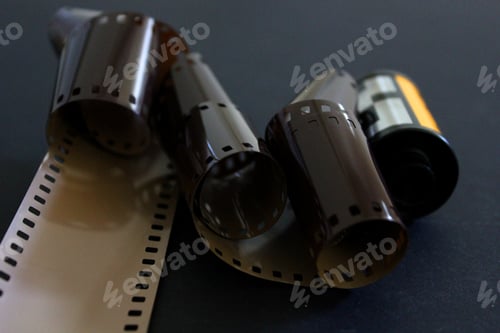 Preview: Exposed roll of Kodak camera film on black background