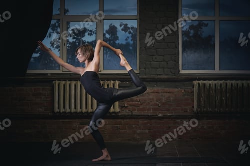 Preview: Beautiful sporty fit yogi woman practices yoga