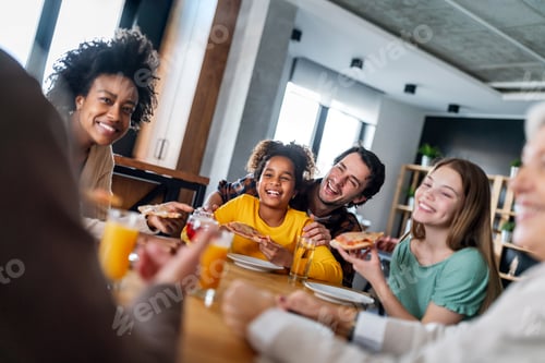 Preview: Multiethnic, three generation family together celebration with parents grandparents and children