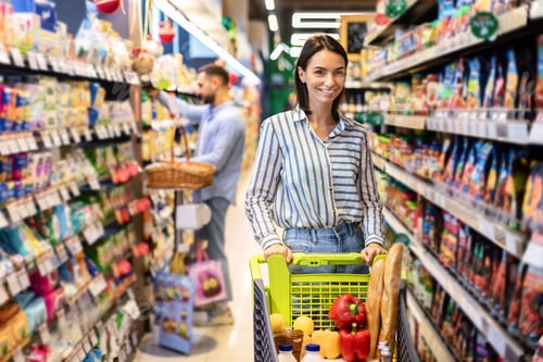 Preview: Casual woman shopping in supermarket with trolley cart