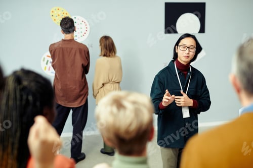 Preview: Asian Guide Talking To Tourists