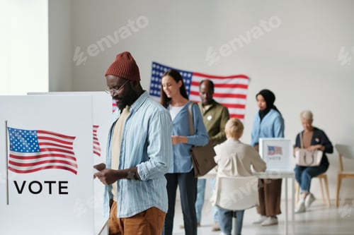 Preview: Group of young multicultural voters standing in queue in polling place