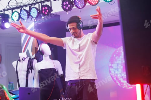 Preview: Young dj in headphones performing