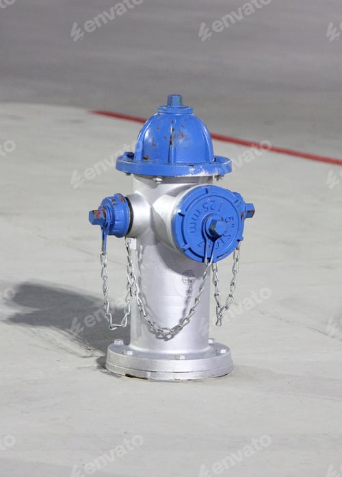 Preview: Silver Fire Hydrant with Blue Top on Concrete