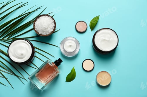 Preview: Different skin care cosmetic products with green leaves on color background, top view