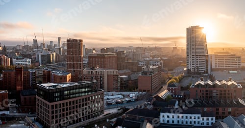 Preview: Aerial panorama of Leeds cityscape skyline with an early morning sunrise