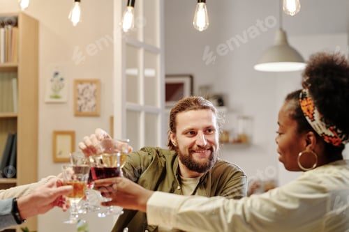 Preview: Happy young man looking at his African American wife with smile
