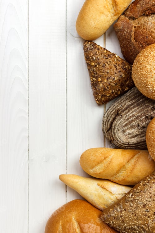 Preview: assorted of bread on white wooden background