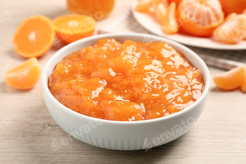 Preview: Delicious tangerine jam on wooden table, closeup