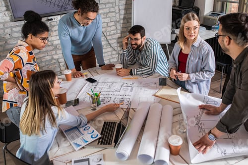 Preview: Group of modern business people discussing architectural designs in the creative office.