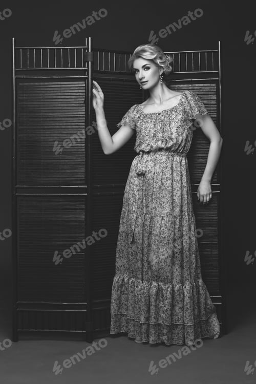 Preview: Beautiful girl standing near folding screen