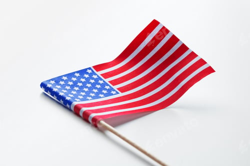 Preview: Small American flag on a white background with a wooden stick shown clearly