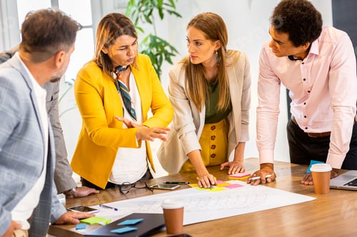 Preview: Group of business people having a meeting in office.