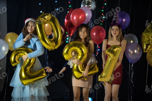 Preview: Happy Asian friends celebrating new year's eve 2021- people having fun together