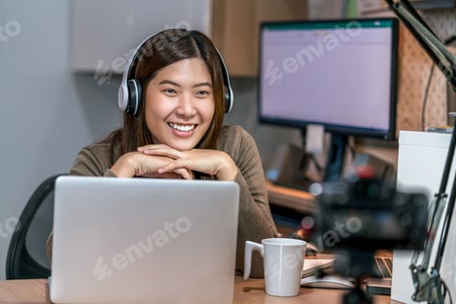 Preview: Asian business woman using technology laptop and working from home in home office