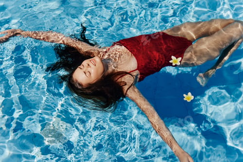 Preview: Woman summer bikini relaxing water young female beauty vacation swimwear swimsuit resort pool