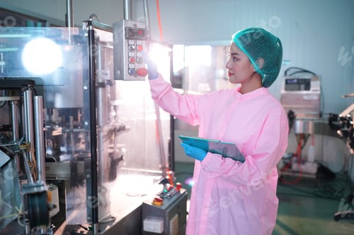 Preview: Industry Worker entering data in machine at factory