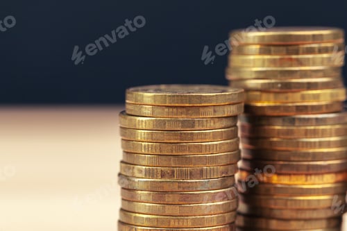 Preview: piles of coins on working table