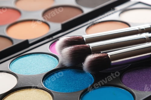 Preview: Close up of eyeshadow palette and brushes
