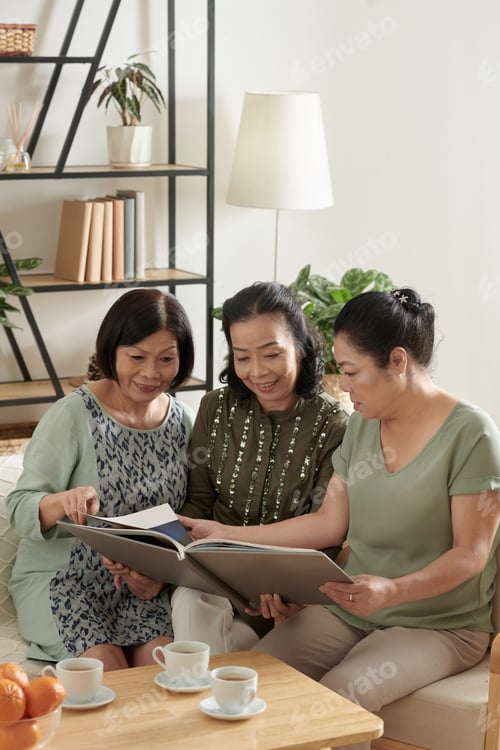 Preview: Elderly Friends Discussing Old Photos