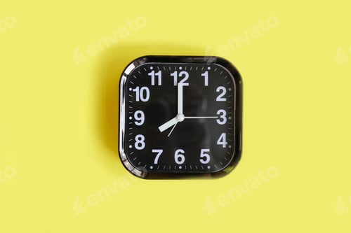 Preview: alarm clock on yellow background.