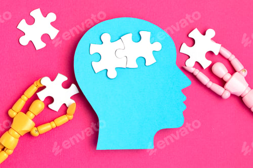 Preview: Papercut head with jigsaw puzzle pieces inside. Mental health problems, psychology, memory, logic
