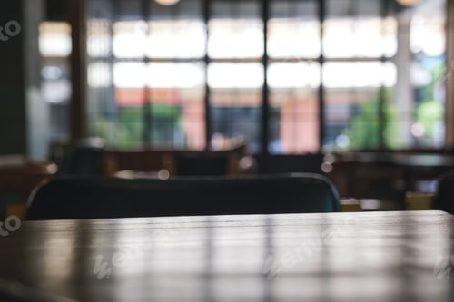 Preview: Wooden table top with blurred background in cafe