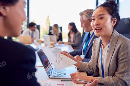 Preview: Multi-Cultural Business Team Meeting And Collaborating Around Table In Modern Office Building