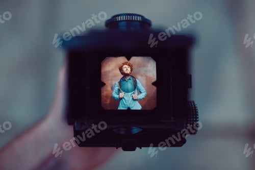 Preview: Shooting a portrait of handsome guy with a vintage camera
