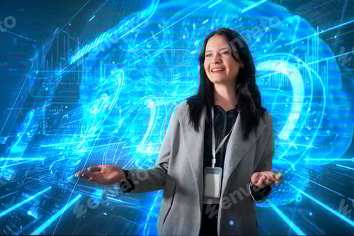 Preview: Woman with dark hair smiles while presenting digital technology concepts in a modern setting