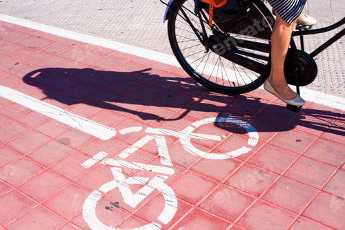 Preview: Signs and bike lane markings painted on the asphalt of the streets of an urban city