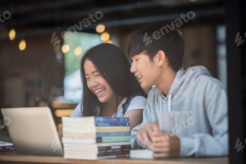 Preview: Group of happy friends student talking about knowledge in cafe