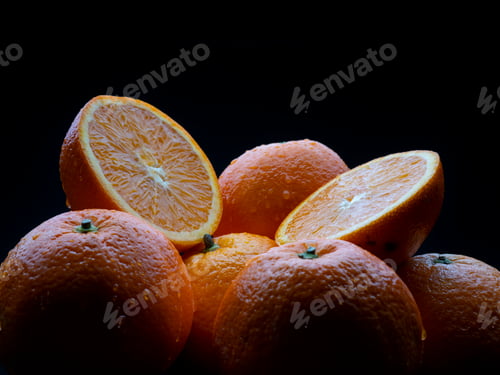 Preview: Macro photography of some juicy oranges on a black background