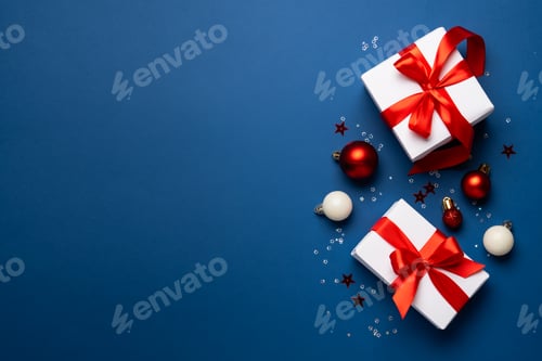 Preview: Festive Christmas Presents and Ornaments on Blue Backdrop