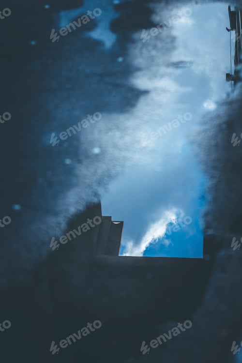 Preview: Reflection of the sky in a puddle