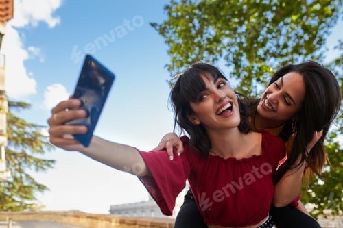 Preview: Two teenager girls taking a selfie.