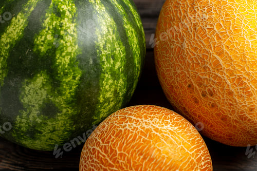 Preview: front view green watermelon whole round formed fresh and juicy fruit with melons on the brown desk