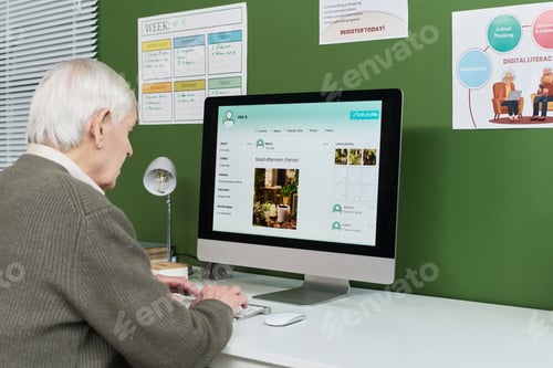 Preview: Senior Caucasian Man Practicing Social Media Skills during Computer Literacy Class