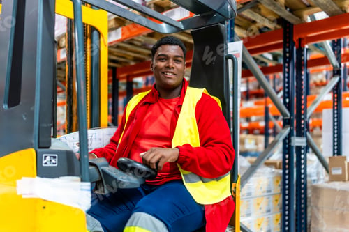 Preview: Latin man driving forklift in a distribution warehouse
