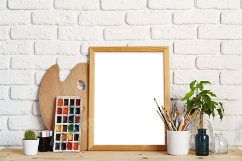 Preview: Blank Picture Frame with Art Supplies on Desk