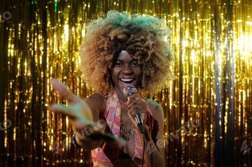 Preview: Singing into Microphone During Festive Performance