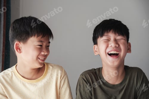 Preview: Happy Asian tween boys laughing, Having a great time together